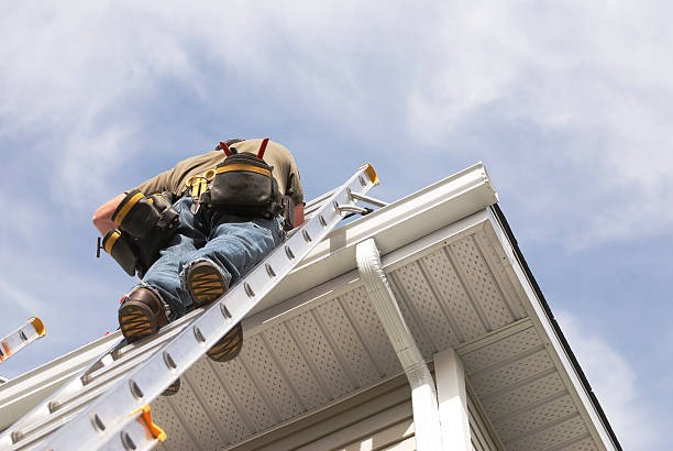 underside shot of a man going up a ladder