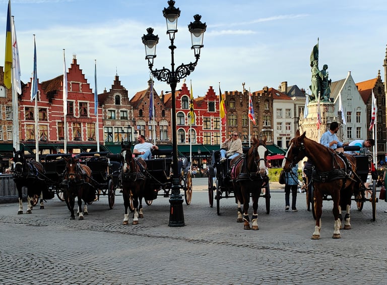 a group of people riding horses in a city