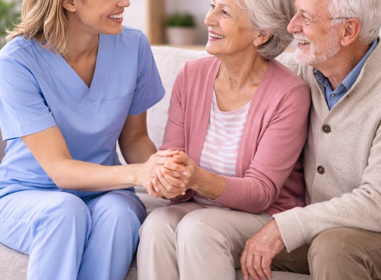 a woman and two men sitting on a couch