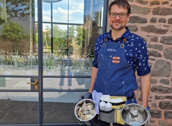 Roaming oyster shucker at a Norfolk wedding