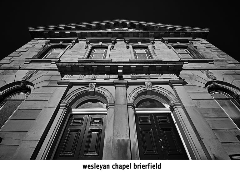 a black and white photo of the wesleyan chapel brierfield