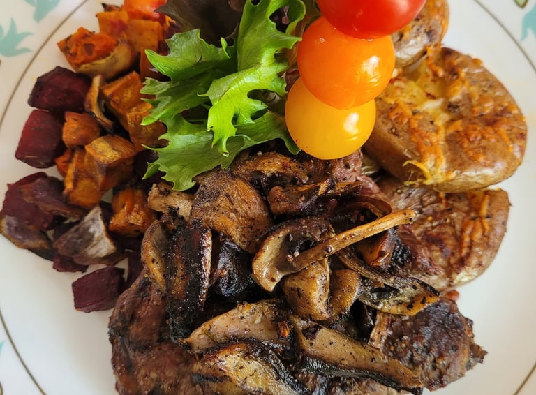beautiful plated meal steak, salad, roasted root veg, cherry tomato skewer