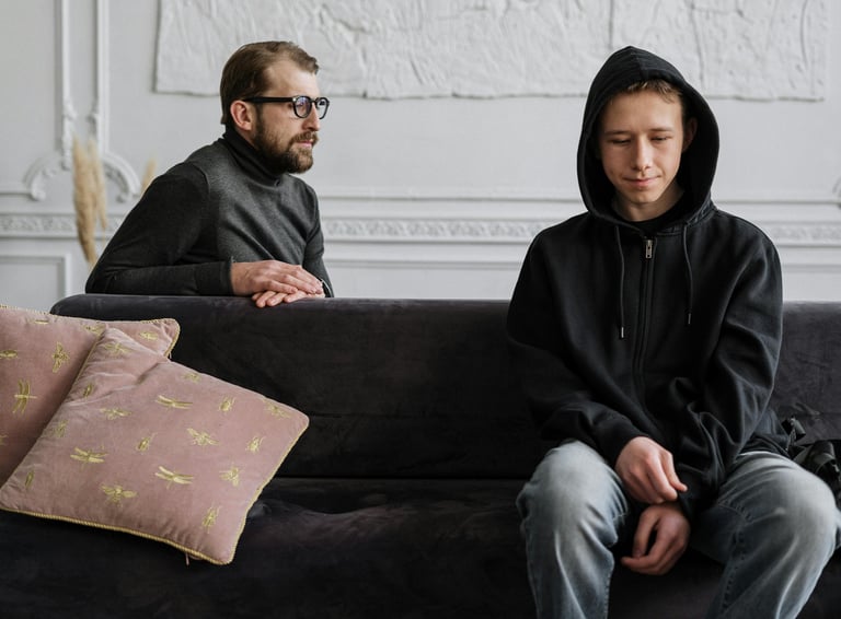 a man and woman sitting on a couch