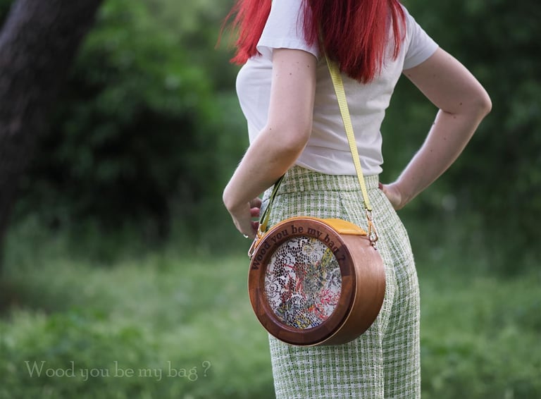 round wooden bag with lace on woman