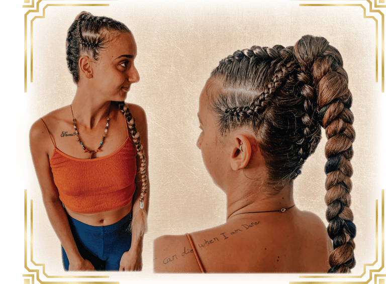 a woman with her hair done for a festival with braids and cornrows