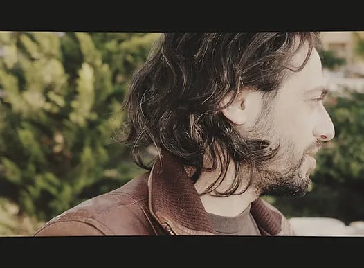 a man with long hair and a beard