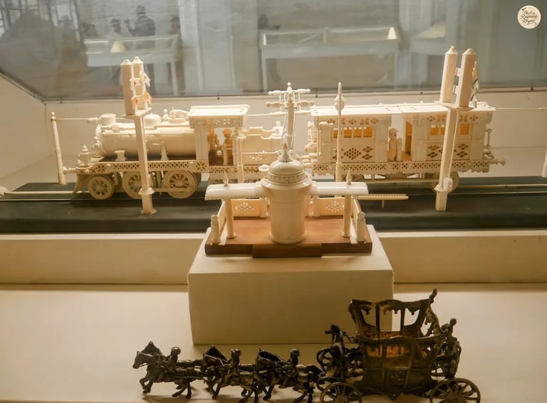 Intricate ivory train model displayed in Jodhpur museum, showcasing fine royal artistry.
