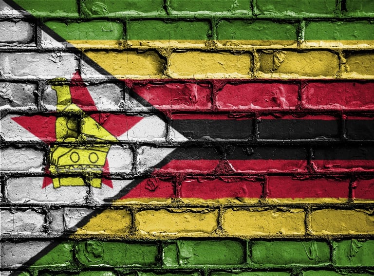 Image of Zimbabwean flag painted on brick wall