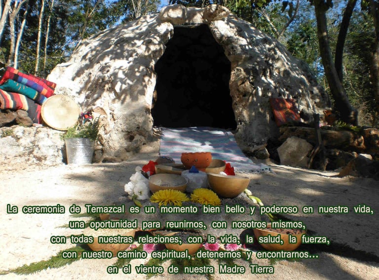 A traditional stone Temazcal sweat lodge with ceremonial items and Spanish spiritual text.