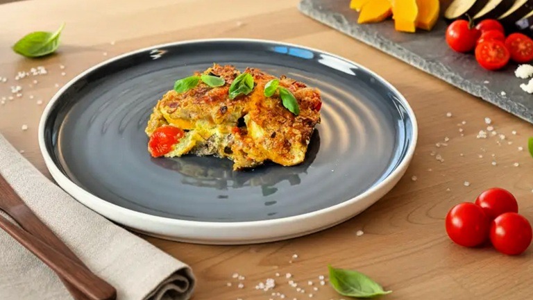 Baked vegetable casserole recipe with pesto cream and savory crumble