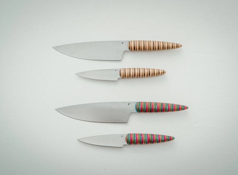 Handmade Kitchen knife with skateboard handle made in Brussels on white background