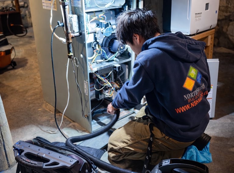 John A. is performing a heating maintenance on a furnace.