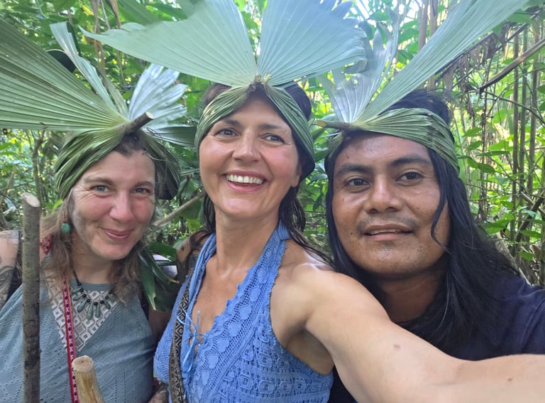 three people standing in front of a forest