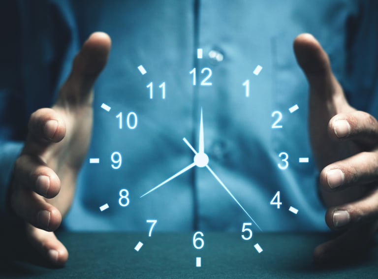 Professional person cupping their hands around a glowing digital clock for time management concept.