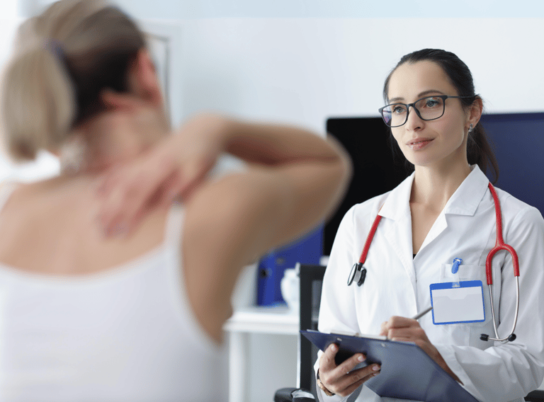 a patient describing an injury in a doctor's office