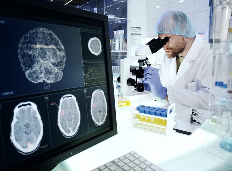 a man in a lab coat and a microscope