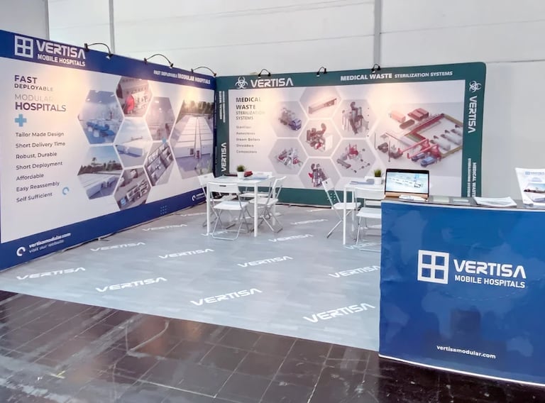 Premium corporate fabric wall exhibition booth for Vertisa Mobile Hospitals at Medica Düsseldorf trade fair.