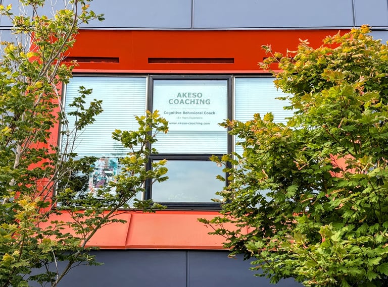 Outside view of windows framed by trees