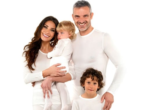 a family of three people standing in front of a white background