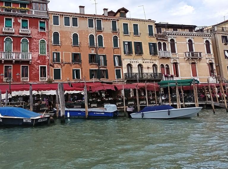 Hotel Marconi and a group of boats on a Canale Grande  in Venice