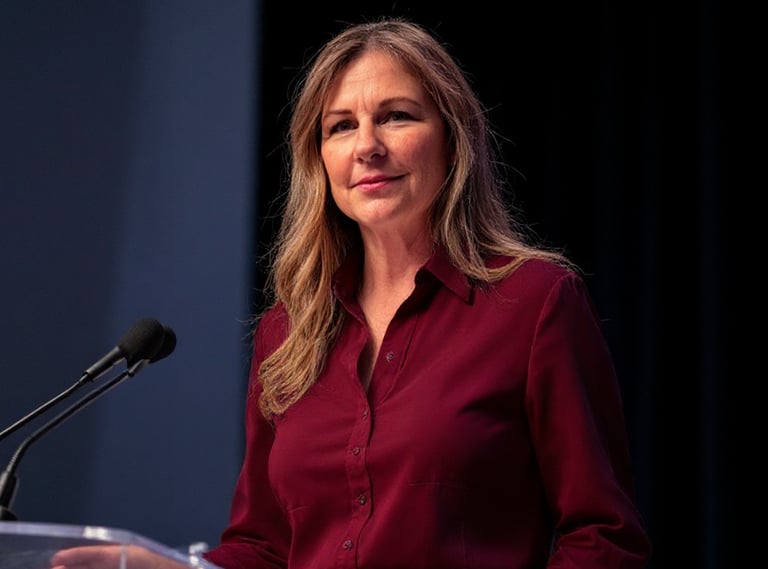 Vulcan Consultant standing at a podium on stage during a keynote on ethical persuaion
