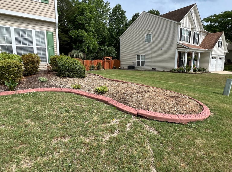 Flower bed that had a large tree removed that we then redesigned as shown in other pictures.