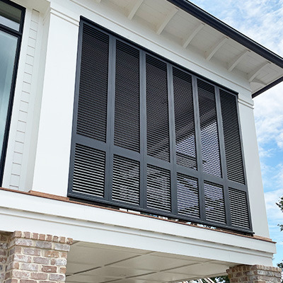 a porch enclosure made from shutters