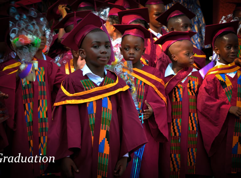 a group of young children in graduation gowns