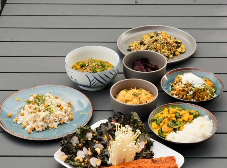 a table with bowls of vegetarian food 