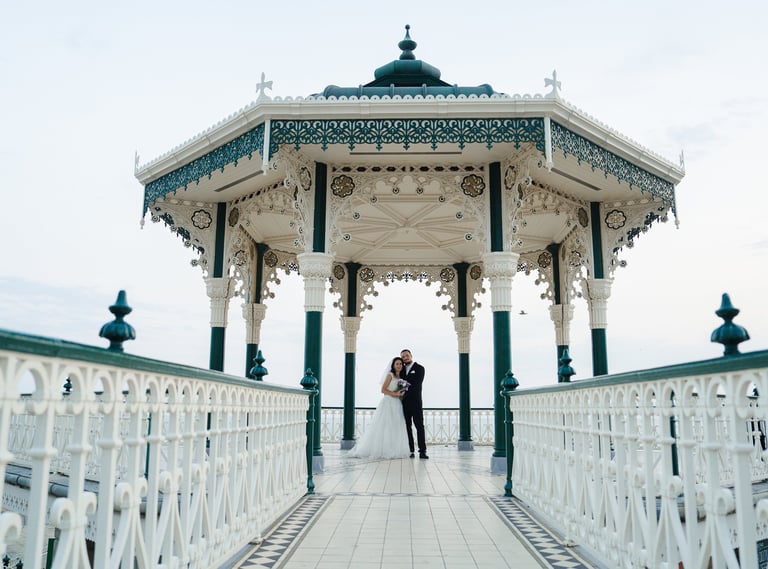 Bride and groom wedding photoshoot at Brighton Bandstand, Brighton Beach