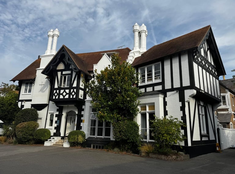Large church property exterior painting in Worthing Sussex, traditional black and white