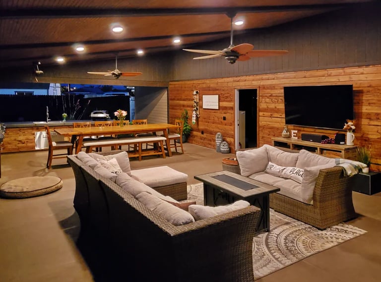 Fully furnished outdoor living room and kitchen.