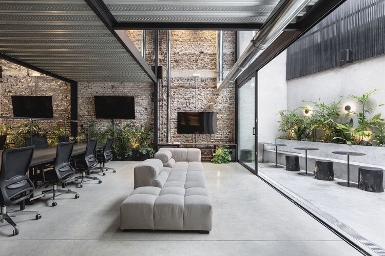 Interior Design of an Office integrating natural elements with furniture .