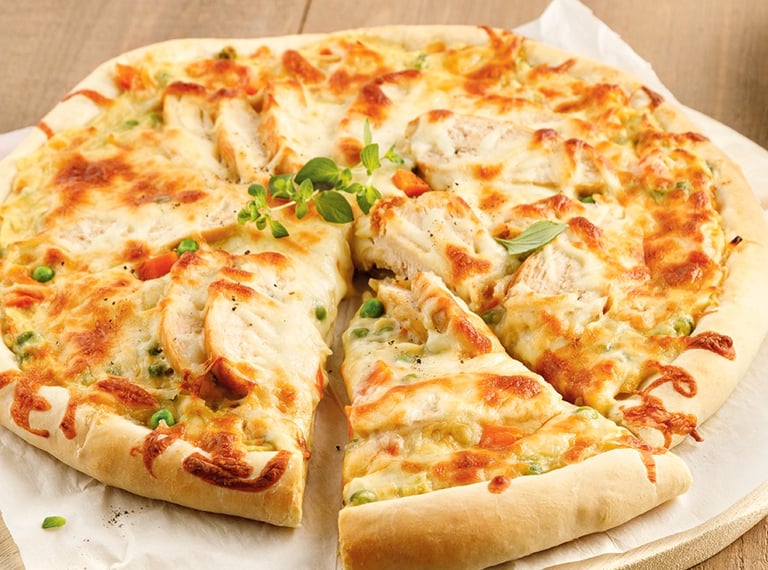 a pizza with cheese and sauce on a wooden table