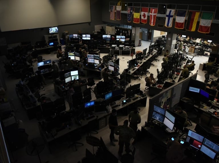 A room full of military personnel and computers