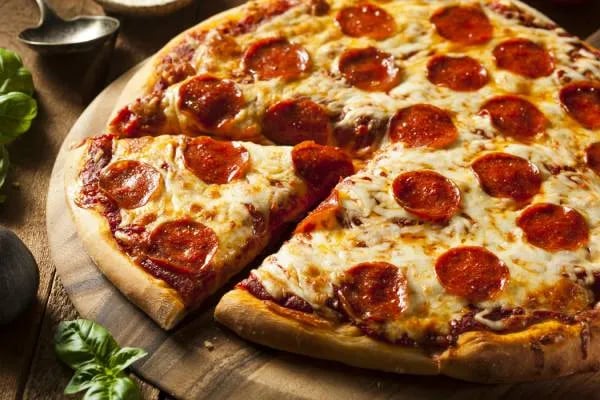 a pizza with a slice missing from the pizza