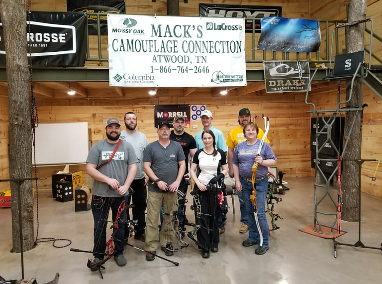Group of individuals trained as archery instructors by Joella Bates. 