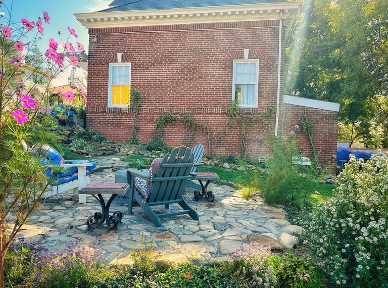 fire pit and flowers outside carriage house with love sign 2123 rivermont