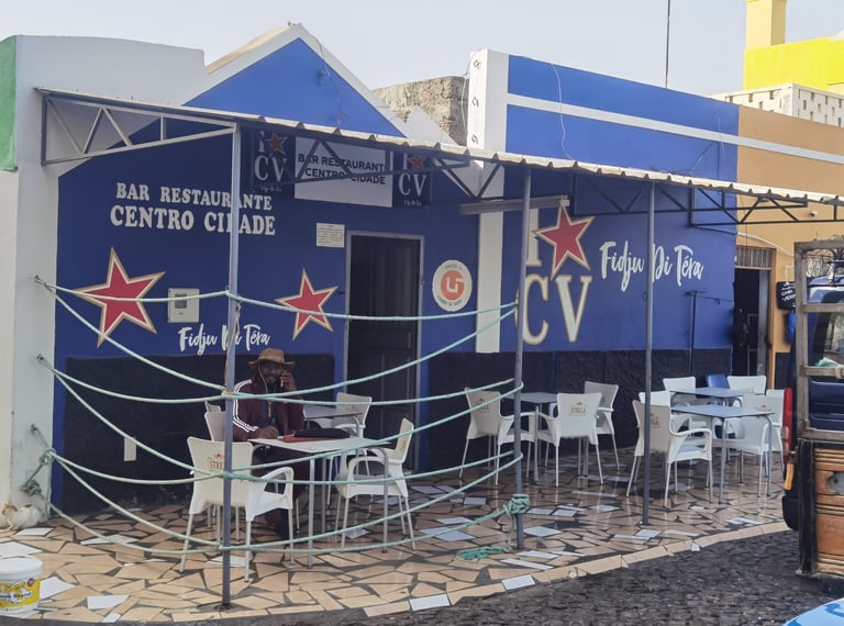 Blue Bar Restaurante Centro Cidade with outdoor patio seating and nautical rope fence in Cape Verde.