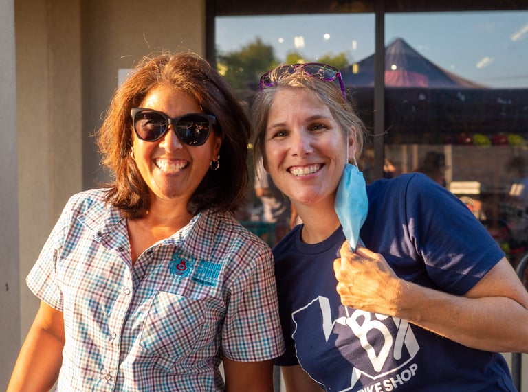 Two smiling women posing for the camera