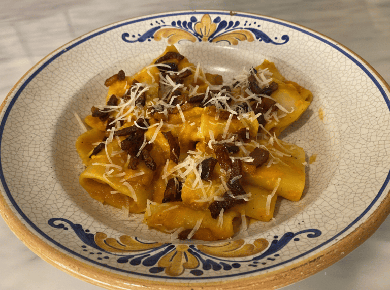 Rigatoni pasta with creamy butternut squash sauce, crispy pancetta, and grated parmesan cheese.