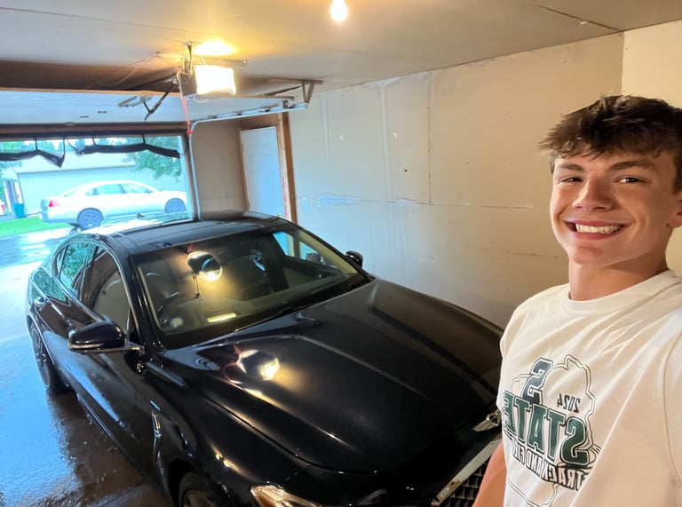Vehicle exterior waxed and buffed for long-lasting gloss.