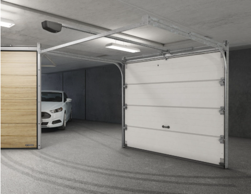a car parked in a garage with a white car