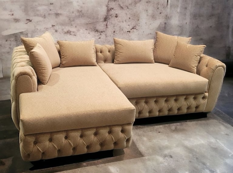Beige tufted sectional with plush cushions and rolled arms, transitional furniture custom-designed