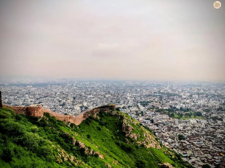 Enjoy the panoramic city view from Nahargarh Fort in Jaipur, a popular sunset spot overlooking the Pink City.