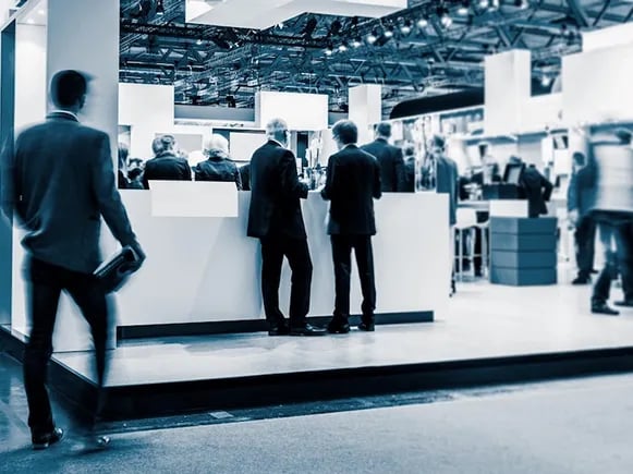 A B2B exhibition space with with business professionals networking