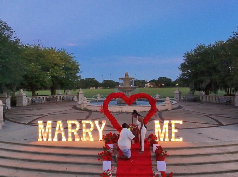 a couple engagement marry me big letters