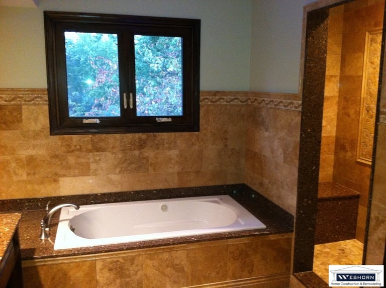 After tile installation, custom build shower, lighting update. Bathroom remodeled in Mount Prospect
