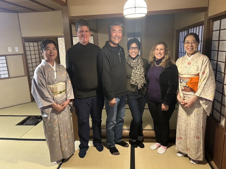 Guests taking a photo with the tea ceremony master in Nagasaki