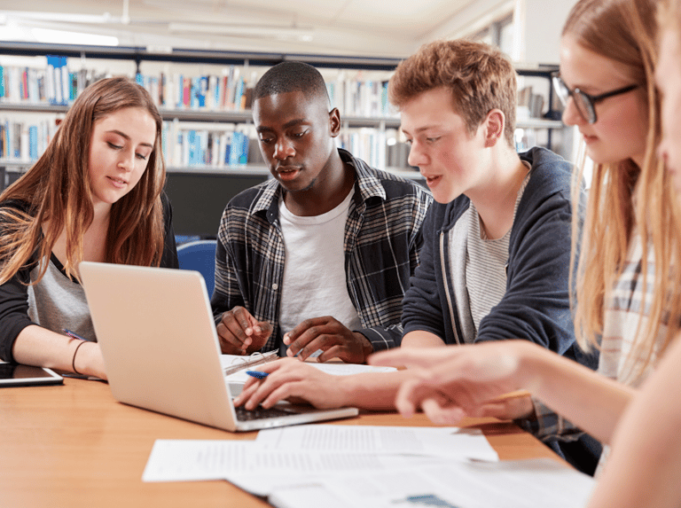 Students collaborating on laptop
